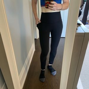 Lululemon black leggings with side pockets in size 2